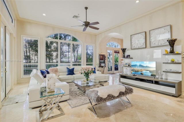 living room with french doors, ornamental molding, light tile patterned floors, and ceiling fan