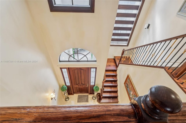 entryway featuring a towering ceiling