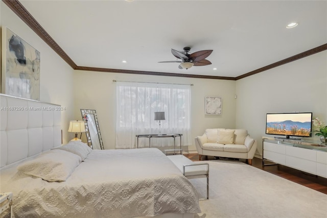 bedroom featuring ornamental molding, dark wood-type flooring, and ceiling fan