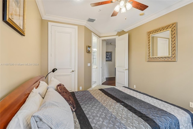 bedroom with ornamental molding, wood-type flooring, and ceiling fan