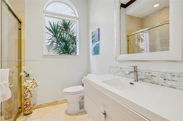 bathroom with vanity, toilet, tile patterned flooring, and an enclosed shower