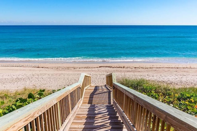 view of water feature with a beach view