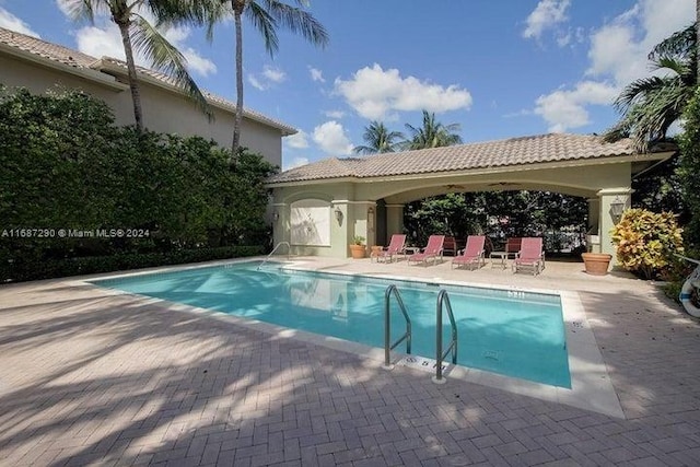 view of swimming pool with a patio and a gazebo