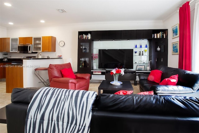 tiled living room featuring ornamental molding