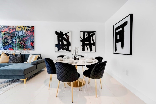 dining space featuring tile patterned floors