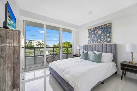 bedroom featuring access to outside and light tile patterned floors