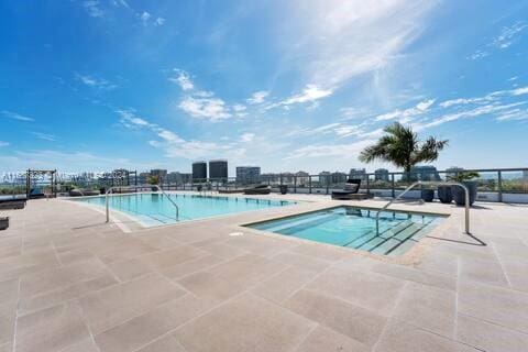 view of swimming pool with a patio area