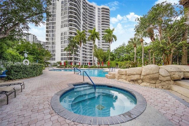 view of pool featuring a community hot tub