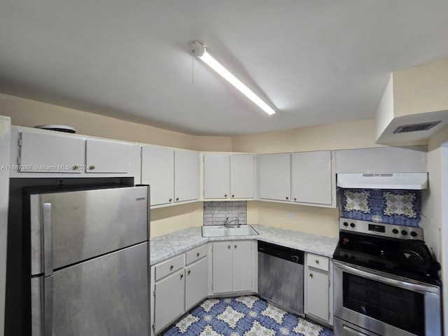 kitchen featuring sink, appliances with stainless steel finishes, exhaust hood, and white cabinets