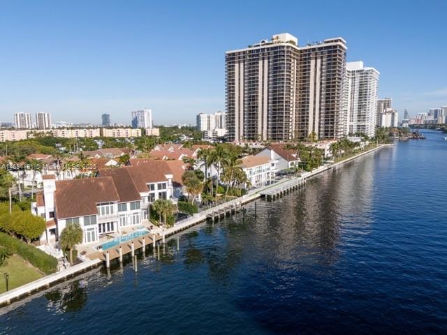 aerial view featuring a water view and a city view