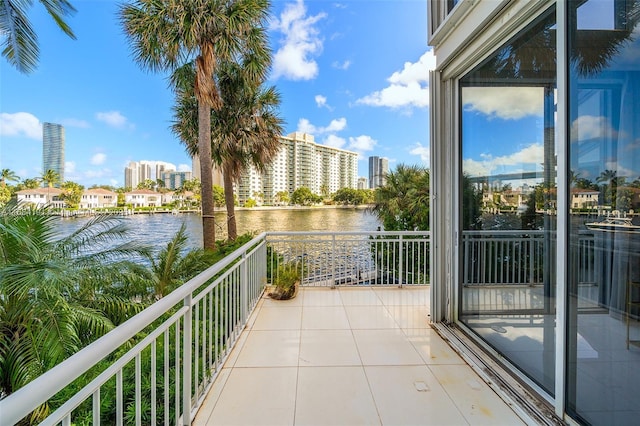 balcony with a view of city and a water view