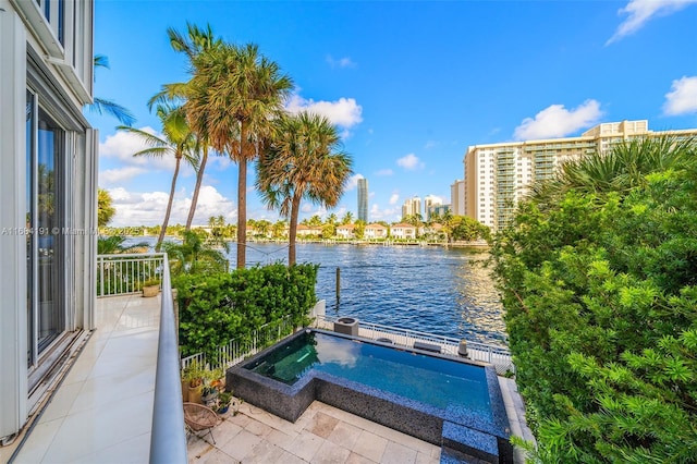 view of pool featuring a water view