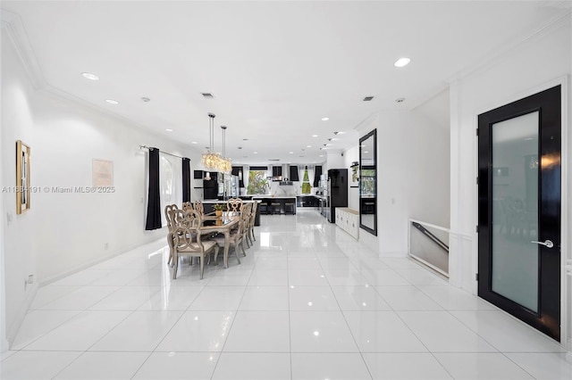 dining space with baseboards, visible vents, light tile patterned flooring, crown molding, and recessed lighting