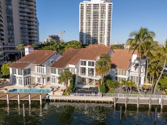 back of house featuring a water view