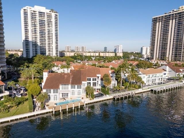 drone / aerial view with a water view and a city view