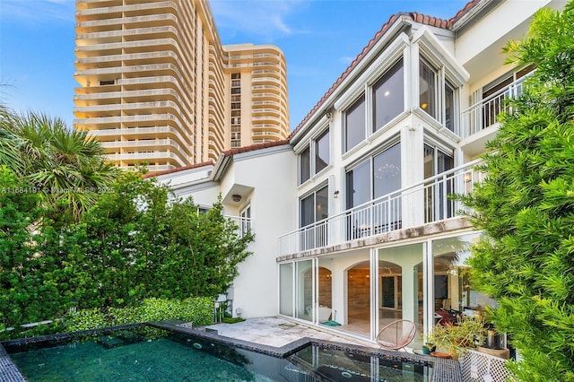 view of property with an outdoor pool