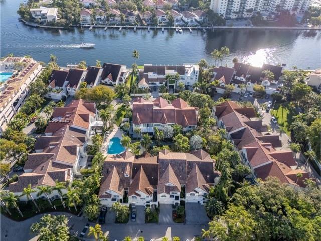 bird's eye view featuring a water view and a residential view