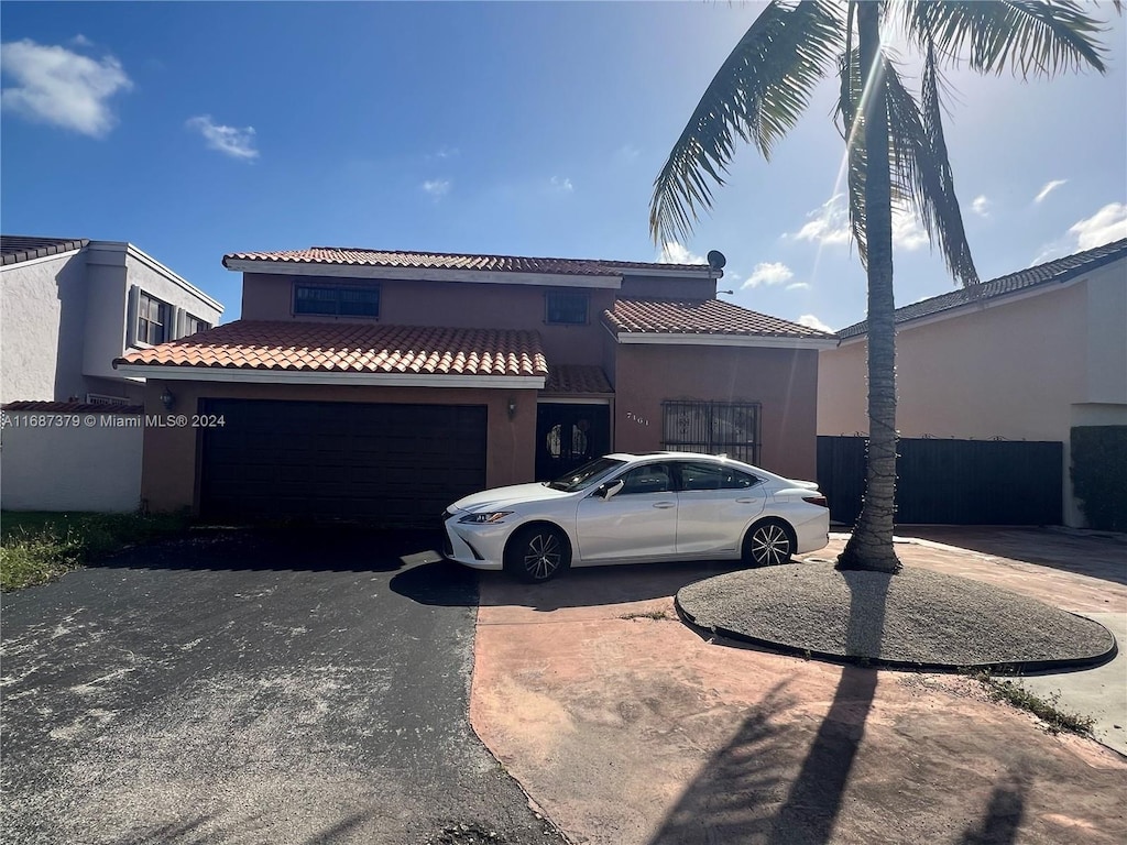 view of front of property with a garage