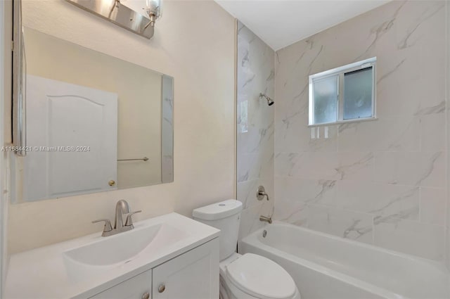 full bathroom with vanity, toilet, and tiled shower / bath combo