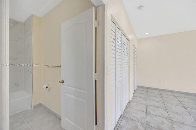 hall with light tile patterned flooring