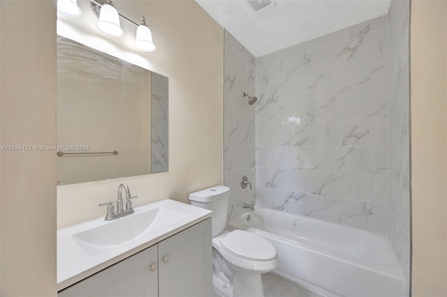 full bathroom with vanity, toilet, and tiled shower / bath