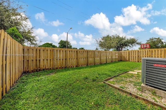 view of yard featuring central AC