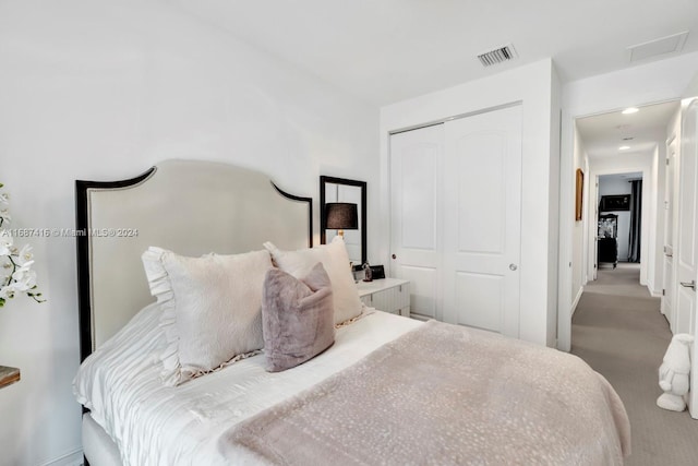 carpeted bedroom with a closet