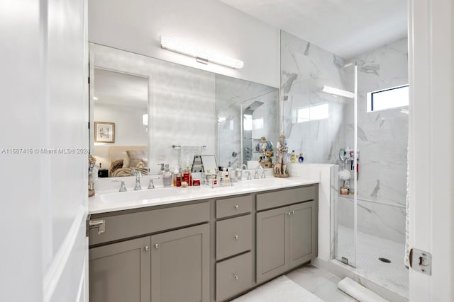 bathroom featuring vanity and a shower with shower door