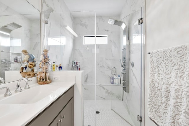 bathroom featuring vanity and a shower with shower door