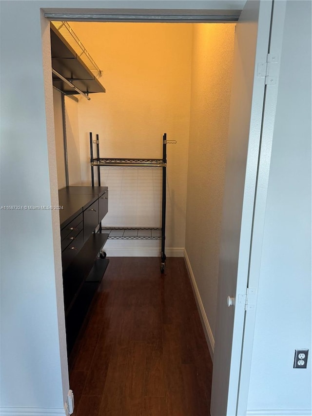 hallway featuring dark hardwood / wood-style floors