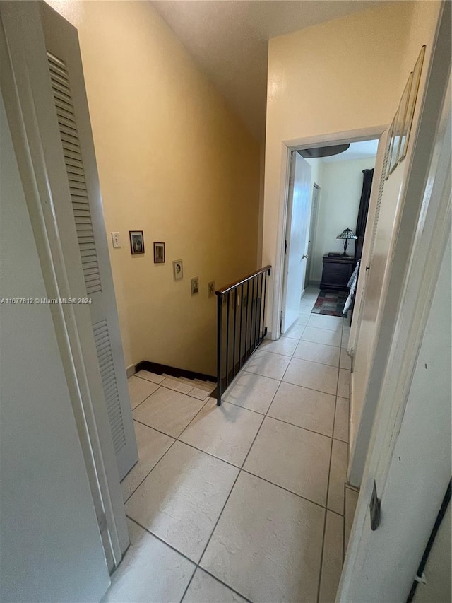 hallway featuring light tile patterned floors