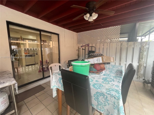 tiled dining room with ceiling fan