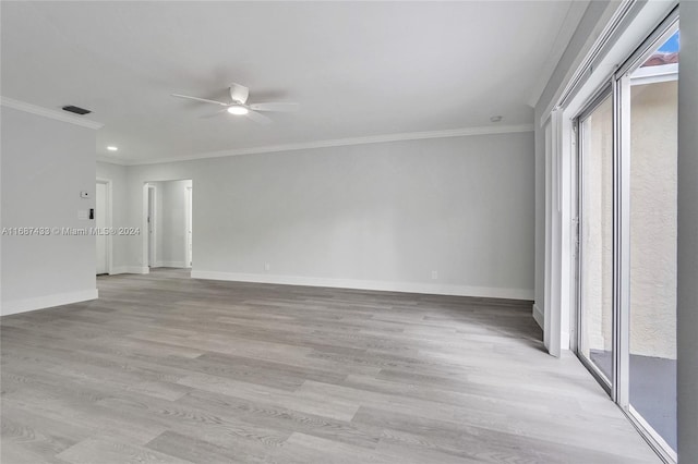 spare room featuring ceiling fan, light hardwood / wood-style floors, and ornamental molding