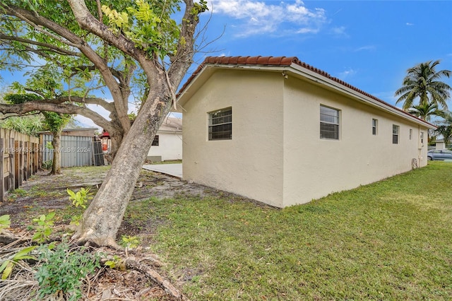 view of home's exterior featuring a yard