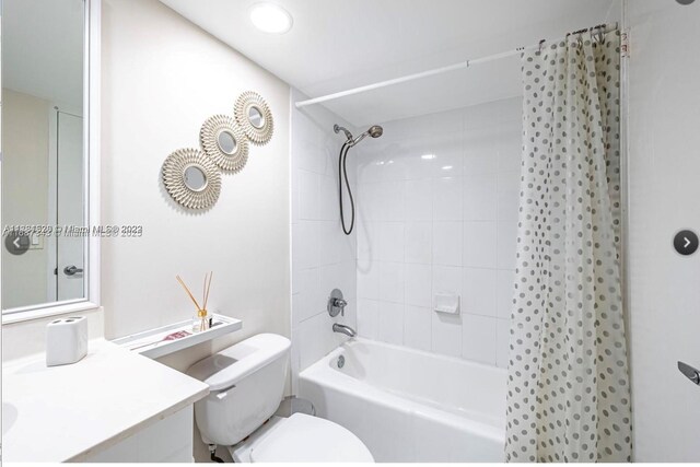 full bathroom featuring vanity, toilet, and tiled shower / bath combo