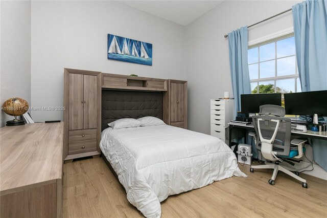 bedroom with wood finished floors