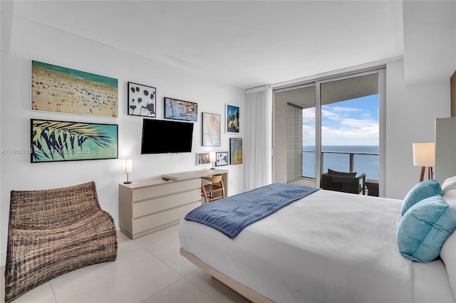 tiled bedroom featuring floor to ceiling windows and access to exterior