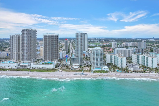 bird's eye view with a beach view and a water view