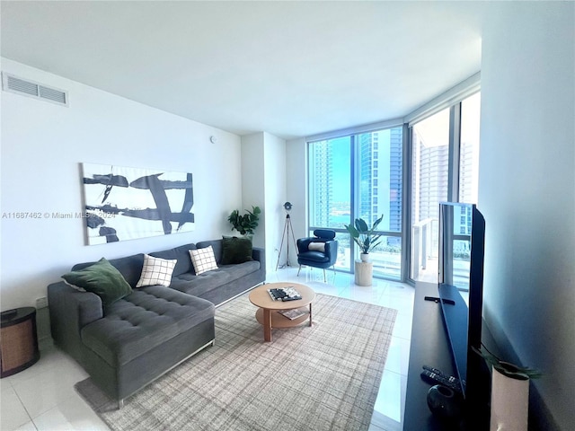 tiled living room with expansive windows