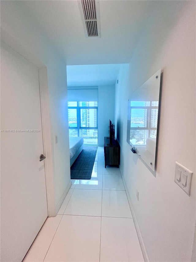 hallway with light tile patterned floors