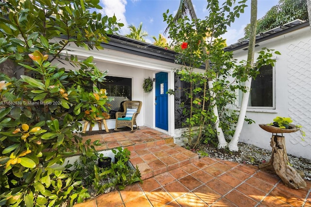 doorway to property featuring a patio area