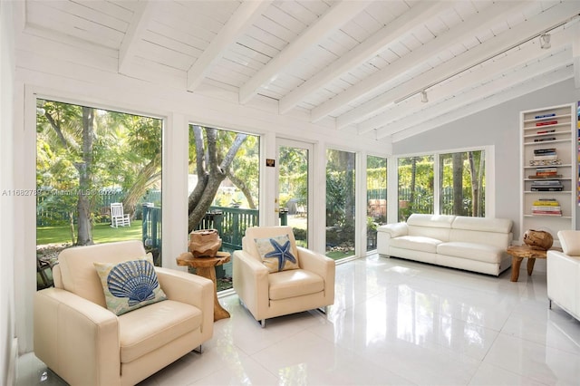 sunroom featuring vaulted ceiling with beams, track lighting, and wooden ceiling