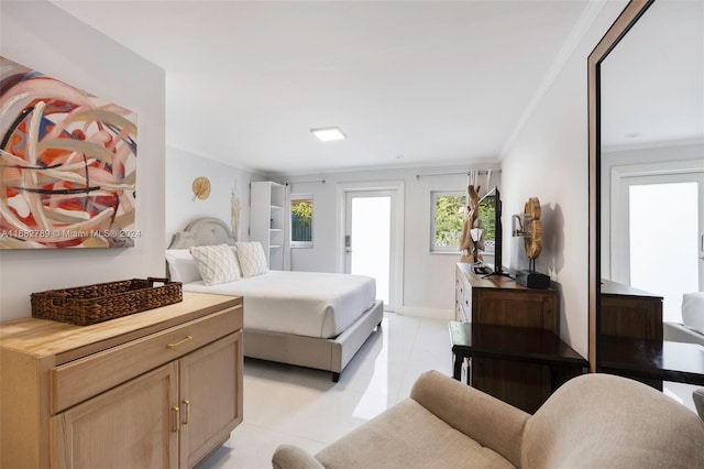 bedroom with light tile patterned flooring, ornamental molding, and access to exterior