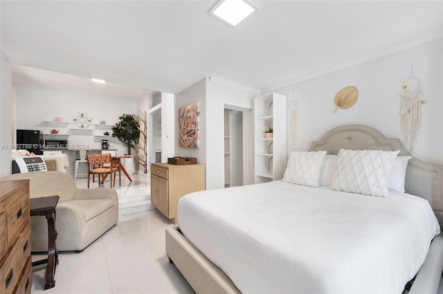 bedroom featuring light tile patterned flooring