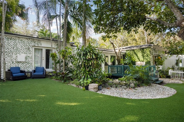 view of yard with a wooden deck