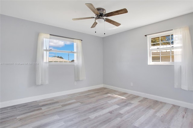 unfurnished room featuring light hardwood / wood-style floors, plenty of natural light, and ceiling fan