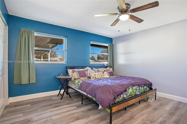 bedroom featuring hardwood / wood-style floors and ceiling fan