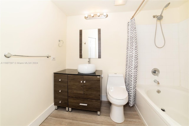 full bathroom featuring toilet, shower / tub combo with curtain, vanity, and wood-type flooring