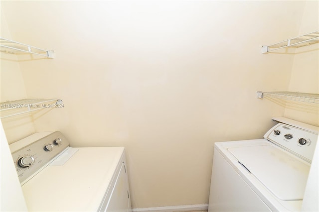 laundry room featuring washer and clothes dryer