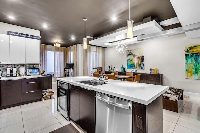 kitchen with a center island, white cabinetry, dark brown cabinetry, decorative light fixtures, and stainless steel dishwasher